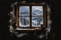 Somewhere Quiet — snowy mountains viewed through a cabin window beside a mug and books.